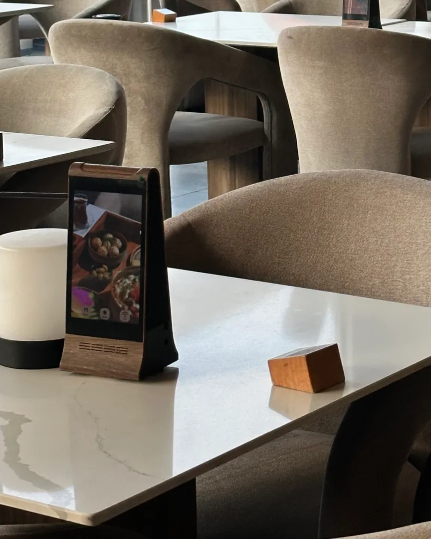 An AYC Frame on a table in a Dubai restaurant