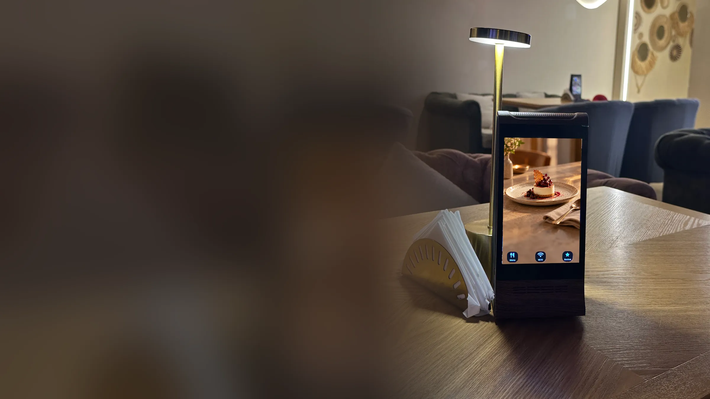 The AYC Frame on a lounge table in Dubai, a dessert on screen