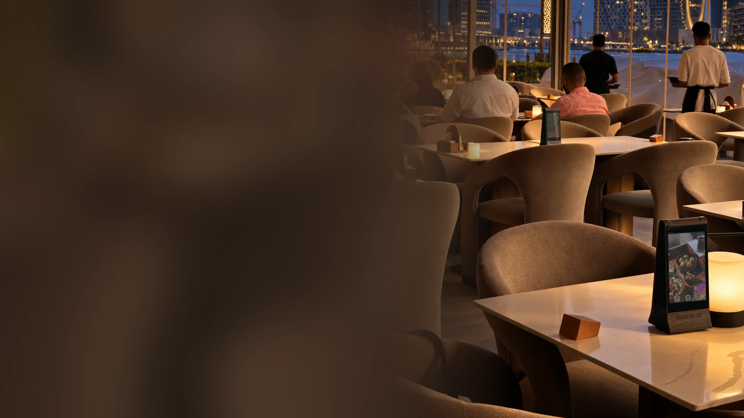 An AYC Frame on a table in a Dubai restaurant at dusk